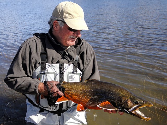 a photo of guide Steve Stoner with a huge splake