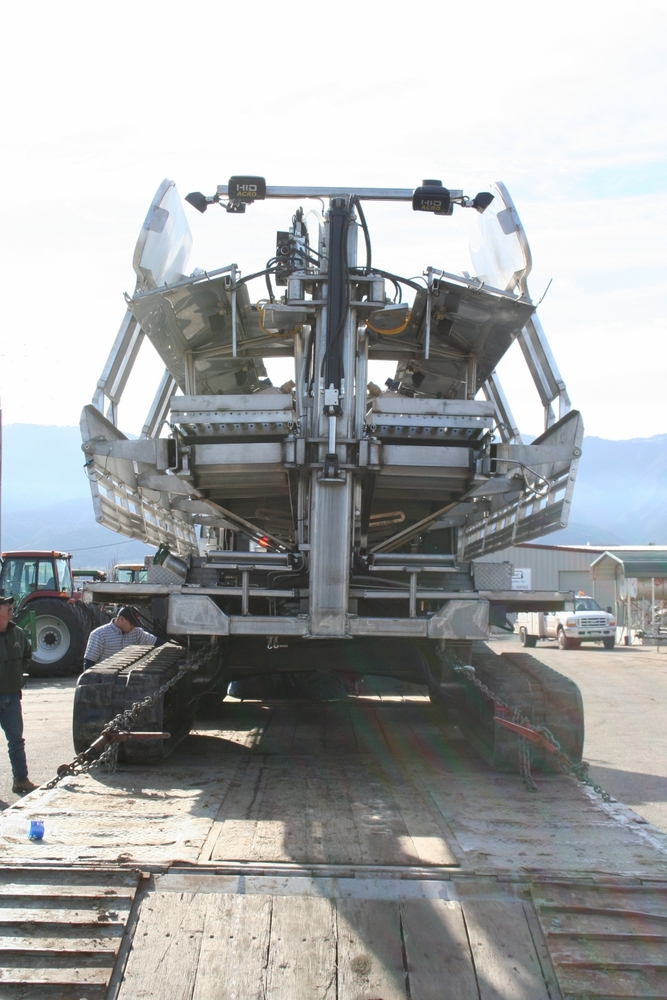 Celery machine with dual tracks and a compact footprint for transport.