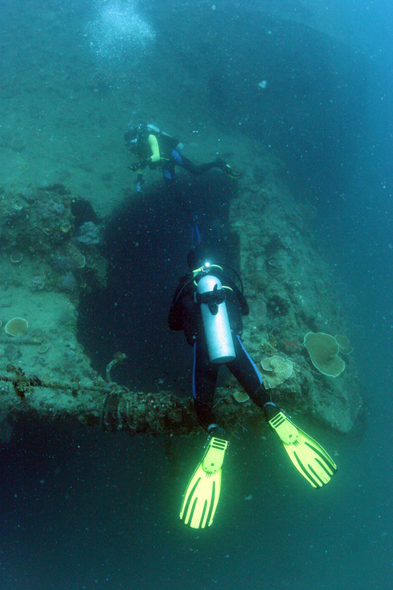 Wreck Diver over the rudder of the Morazan Maru in Coron Bay.