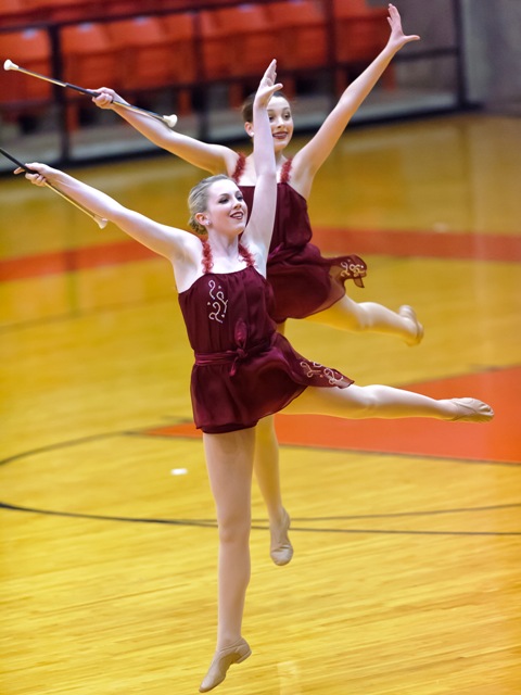 Megan Norton, (front), and Lindsay Richards, (back), leap during their Team performance at the 2013 Southwest Regional contest.
