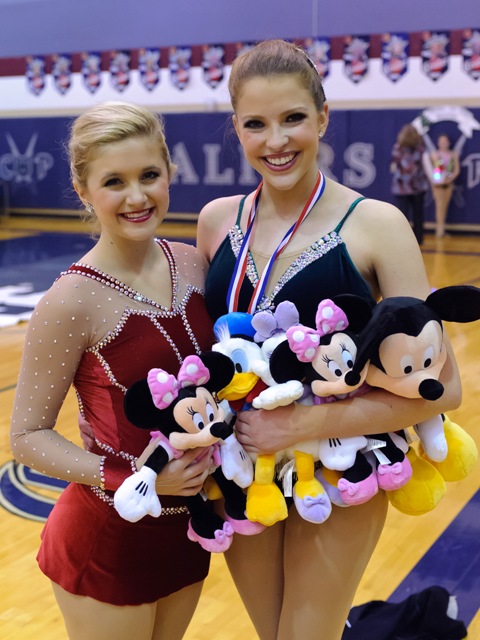 Caroline Carothers, (on the right), stops for a quick picture with her Mickeys Majorette teammate Lindsey McCormick after the 2013 Twirl In The Woods contest held in The Woodlands, Texas. 