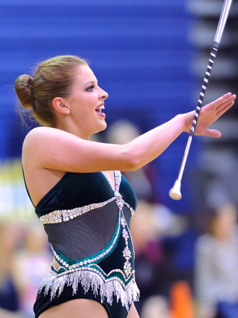 Caroline Carothers twirls in front of a crowd at the 2013    Twirl In The Woods twirling contest in The Woodlands, TX