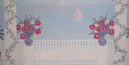 White balcony with flower pots and ocean view with sail boat, blue sky with blue ocean